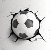 Футбольный мяч в стене